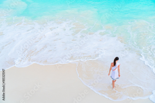 Woman at beach having a lot of fun in shallow water