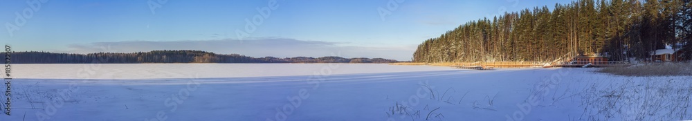 The pier on the frozen lake Yanisyarvi in Karelia, Russia