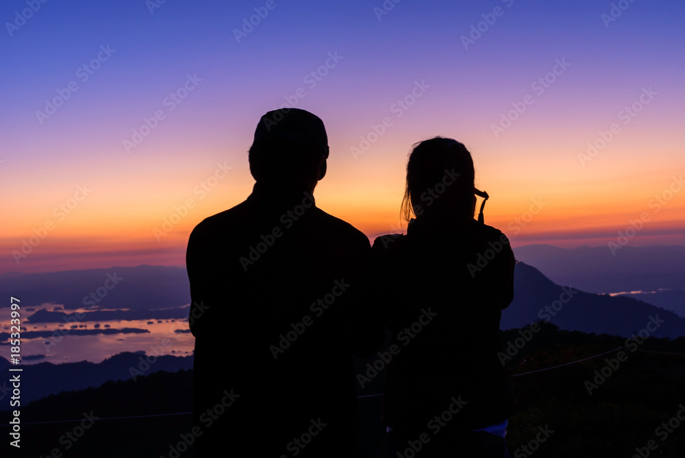  silhouette shadow traveler on high mountain in sunset time