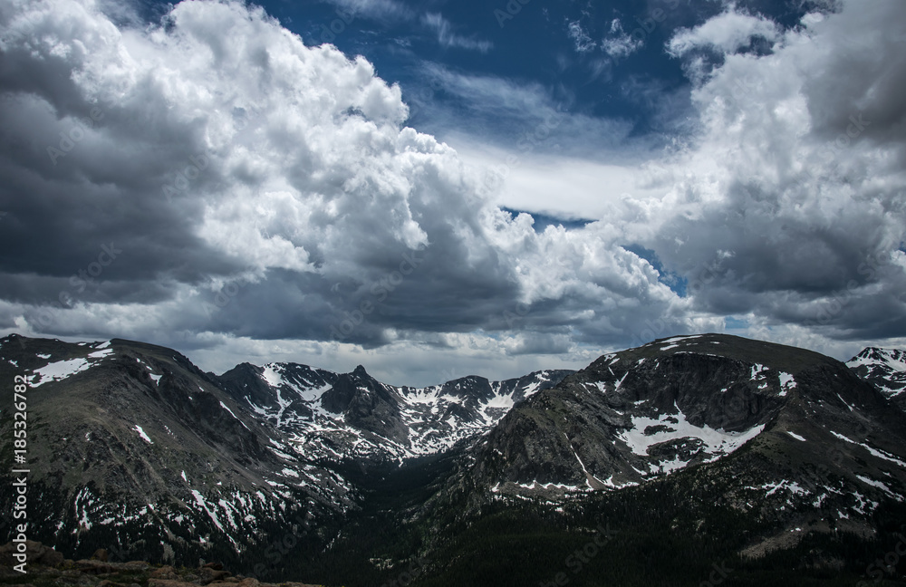 Rocky mountains in summer. Gloomy snowy weather in Colorado