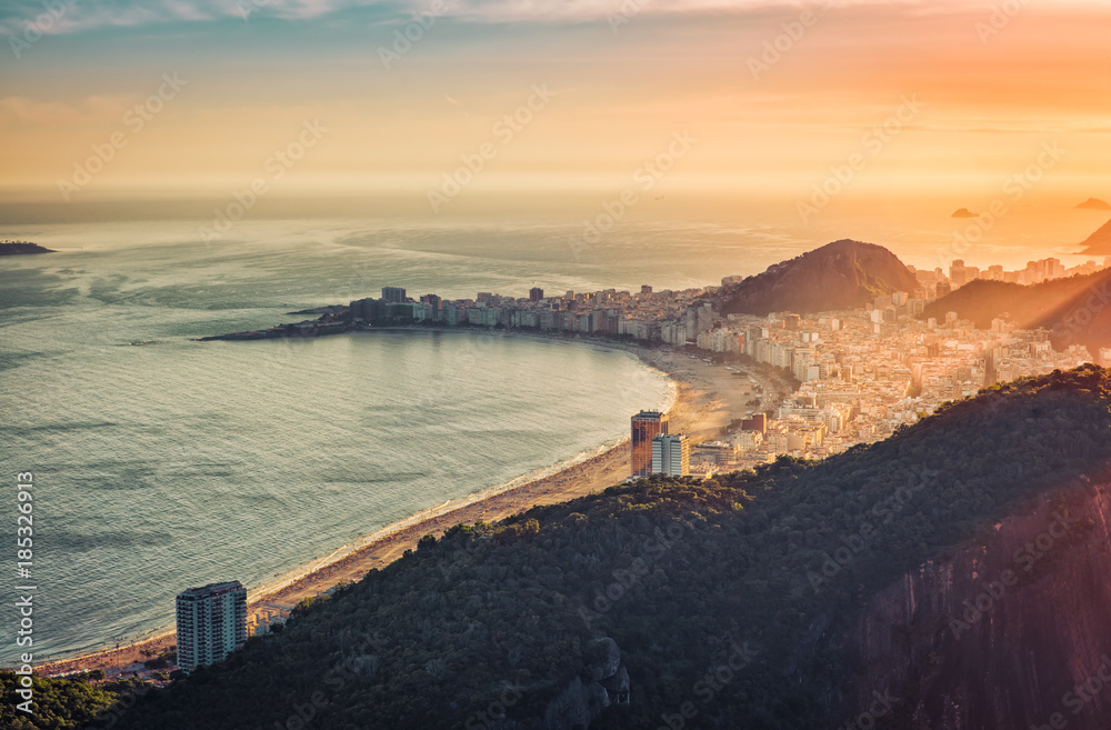 Sunset over Copacabana Beach in Rio de Janeiro, Brazil. Warm late afternoon light Sunset over Copacabana Beach in Rio de Janeiro, Brazil. Warm late afternoon light