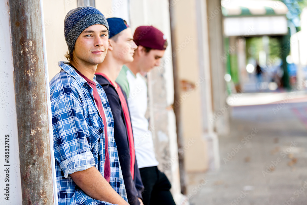 Teenage friends standing at the street