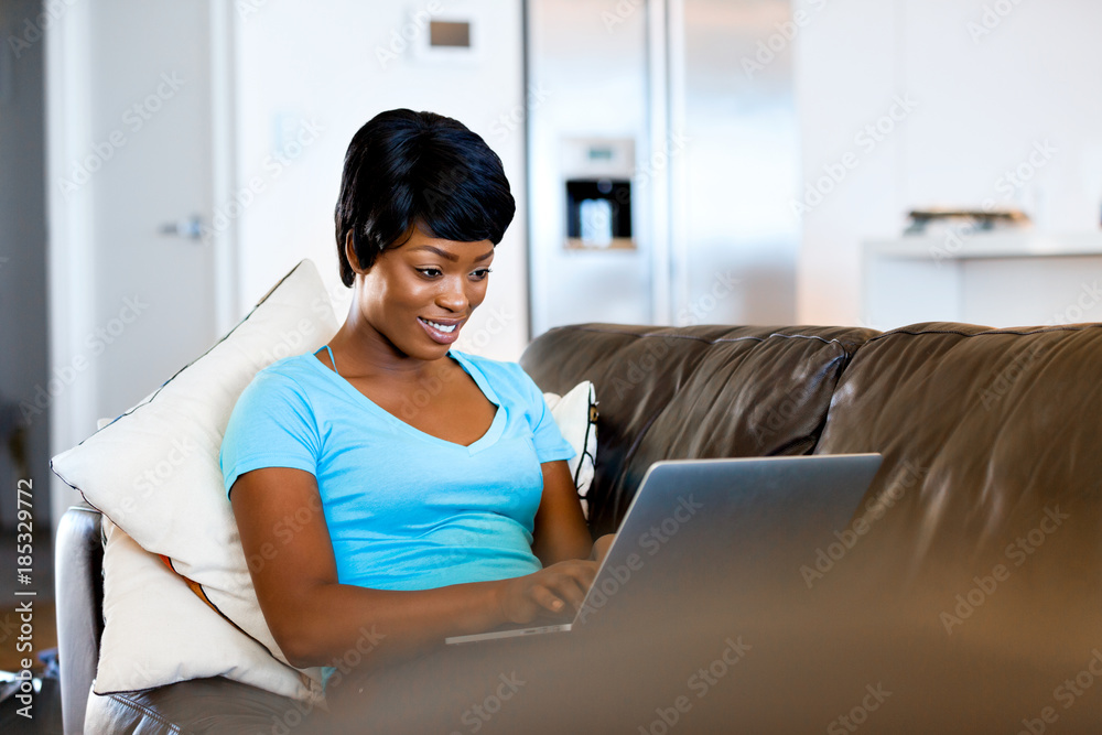 Young beautiful woman working on her laptop Young beautiful woman working on her laptop