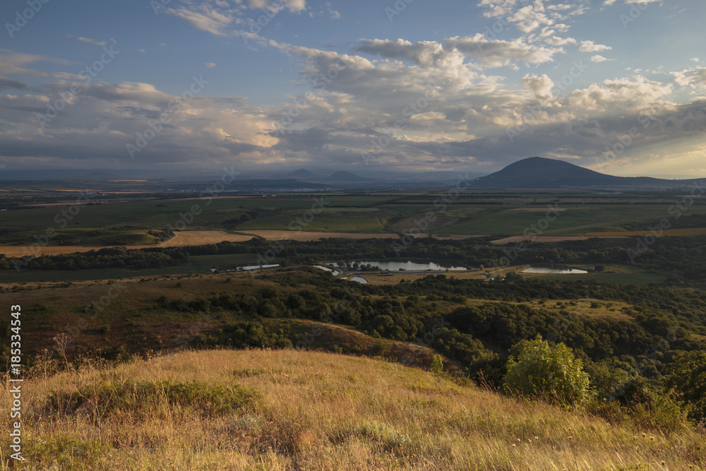 Obraz premium Summer views of the snowy mountains of the Caucasus. Formation and movement of clouds over mountains peaks.