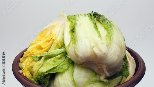 Rotate salt pickled cabbage for kimchi on crock.