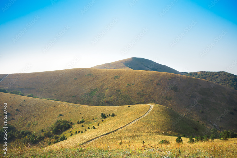 Obraz premium Mountains landscape with road