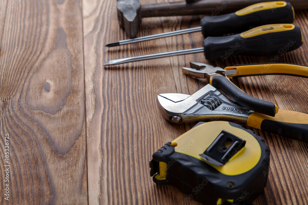 Set of different building equipments on the wooden table