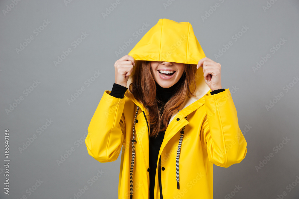 Portrait of a smiling girl dressed in raincoat Portrait of a smiling girl dressed in raincoat