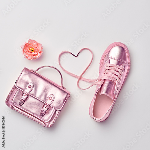 Fashion. Woman Gold Accessories Set. Flat lay. Trendy fashion Handbag, Glamour Shoes, Heart, Flower. Minimal Style. Luxury Spring Hipster Girl. Love, Valentines day