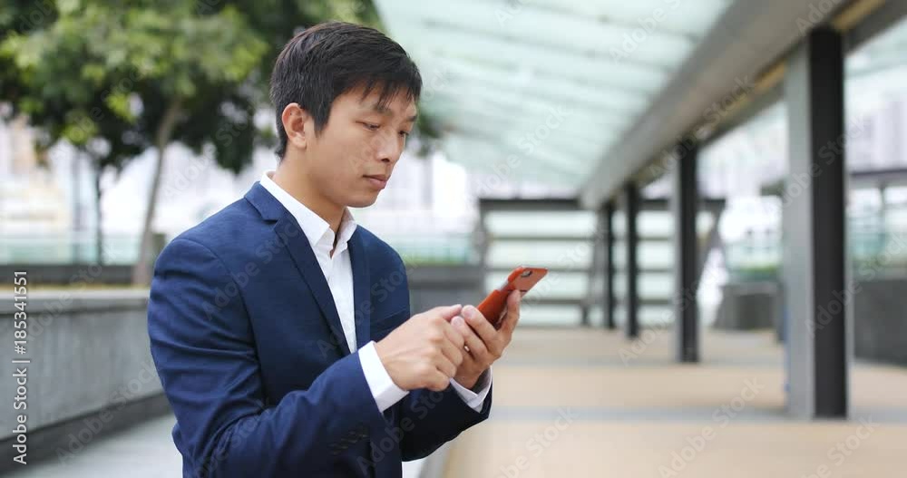 Businessman use of smart phone at outdoor Businessman use of smart phone at outdoor