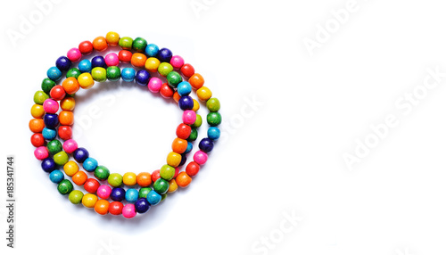 Multicolored wooden beads on a white background.