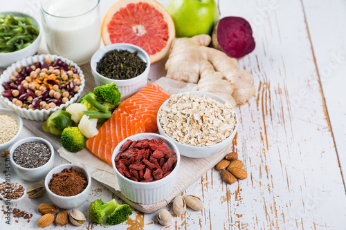 Selection of superfoods on rustic background