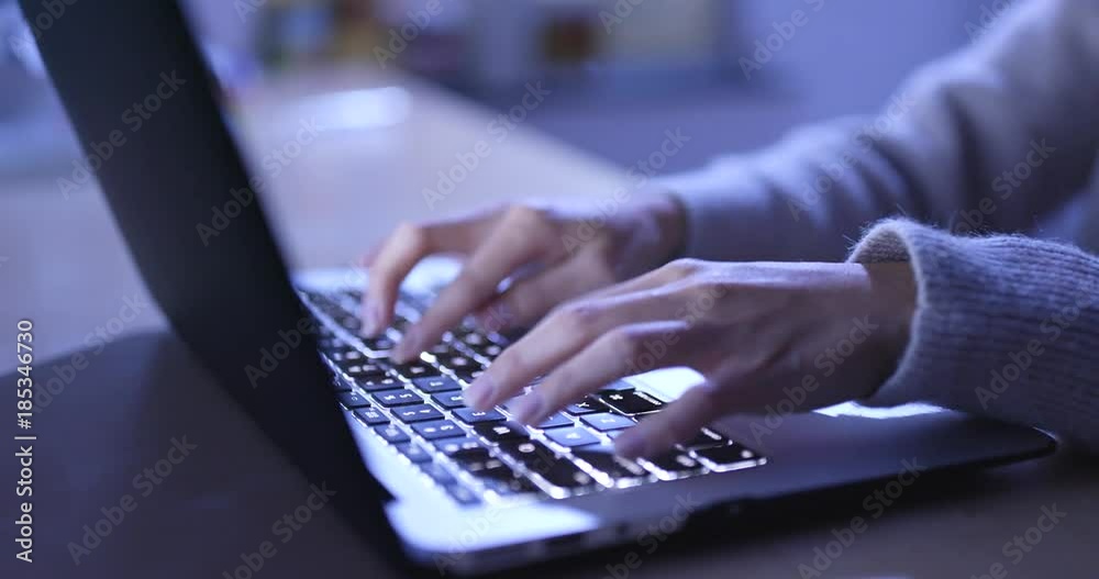 Woman use of laptop computer at night