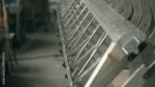 Panoramic shot of the parts of aircraft fuselage in the assembly shop. Inside aircraft workshop. Aviation industry development.