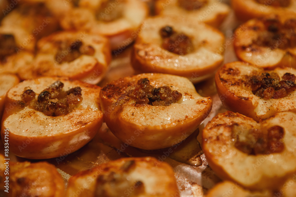 baked halves of apples with honey, cinnamon and raisins