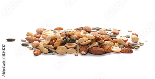 Healthy mix of salty and spicy peanuts, almonds, sunflower, and pumpkin seeds, isolated on white background