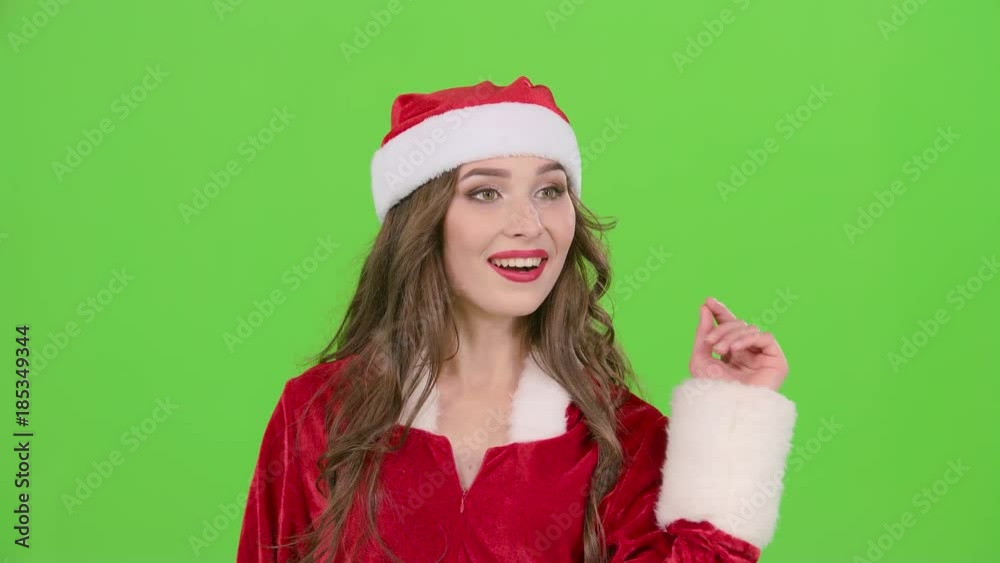 Santas assistant flirts and waves her hand to her boyfriend. Green screen Santas assistant flirts and waves her hand to her boyfriend. Green screen