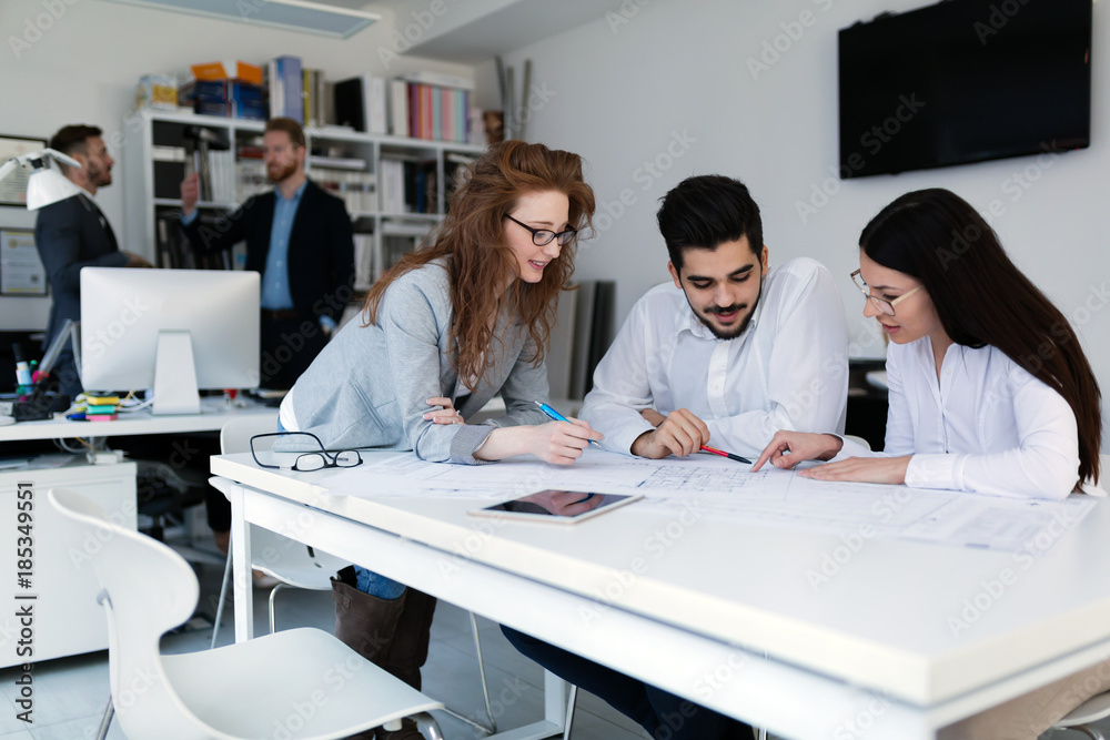 Group of architects working together on project Group of architects working together on project