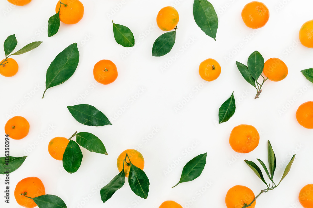 Frame of citrus fruits with leaves on white background. Flat lay. Top view