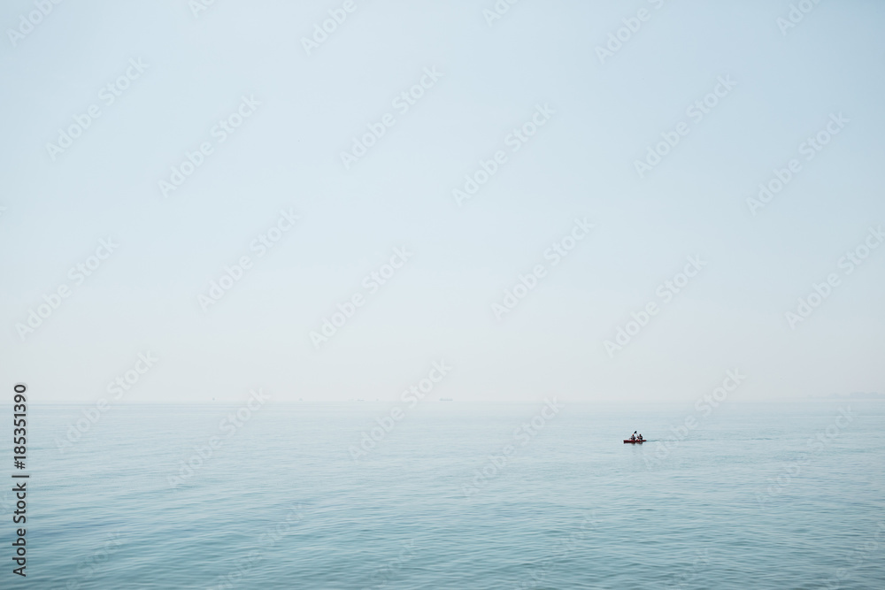 Lonely ship in a calm blue sea