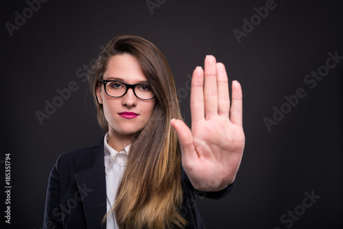 Cuadro en lienzo Serious businesswoman gesturing stop sign