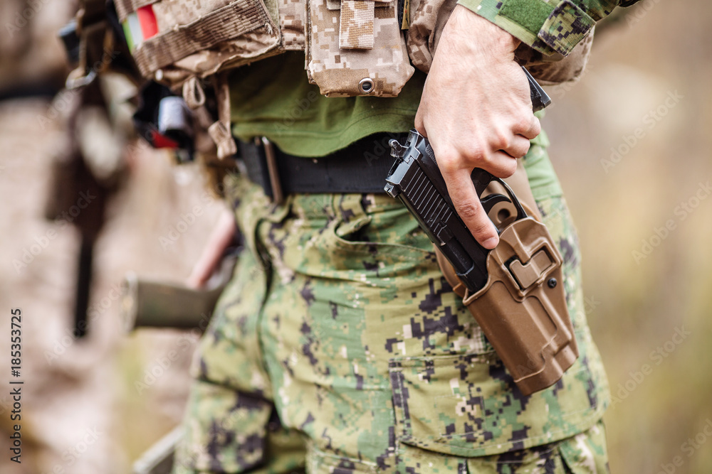 Ranger wearing uniform with gun in hand,keep gun in the holster. military concept