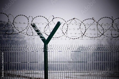 Barb wire fence at the cold winter day