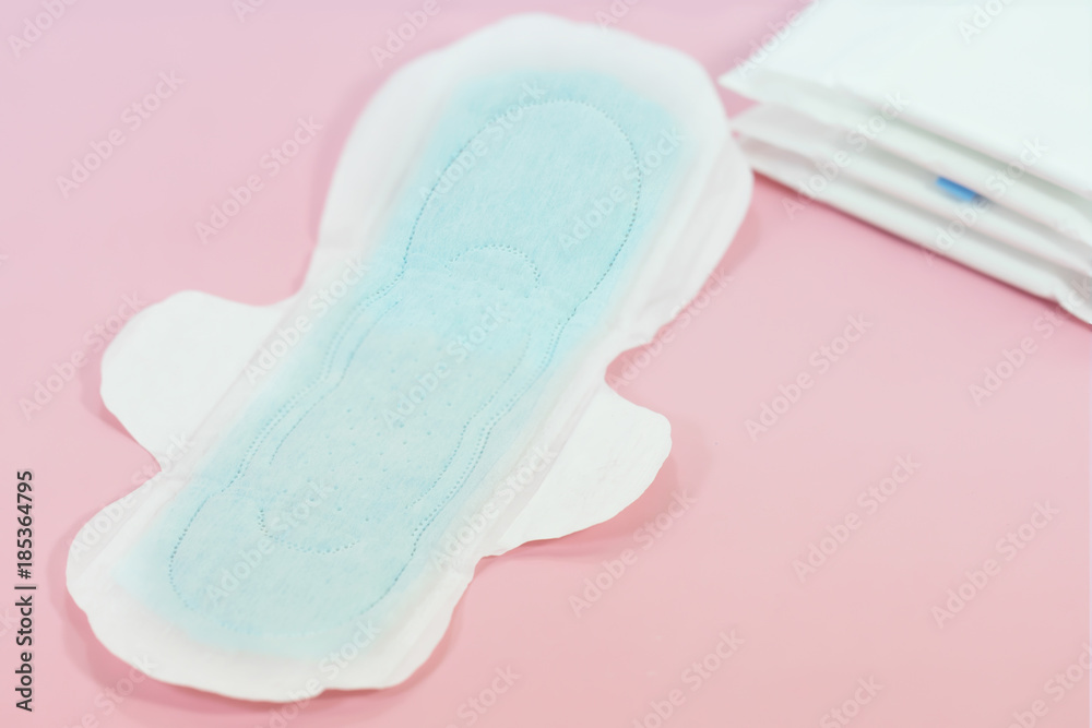 Sanitary pads and absorbent sheets on a pink background Sanitary pads and absorbent sheets on a pink background