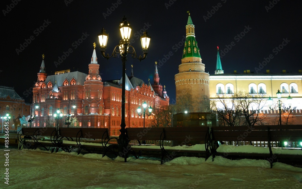 Obraz premium View of the Historical Museum near red Square at night. Moscow, Russia/ In Gothic style, of red brick. Taken late evening, before Christmas, festive illumination and decoration of the city