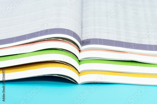 stack of magazines on blue background