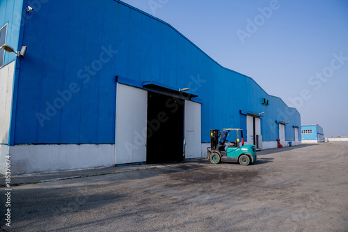 Blue big factory or warehouse building exterior