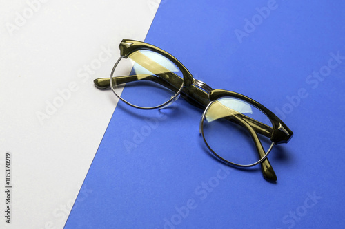 Vintage glasses on colorful background, conceptual image