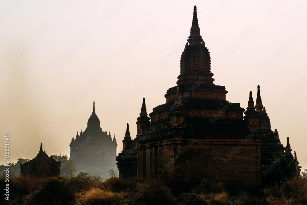 BAGAN, MYANMAR - March 6, 2017: Silhouette of temples in Bagan. Ancient Pagoda. Sunrise in Bagan