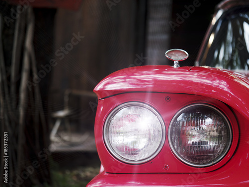 Headlights red vintage car close up