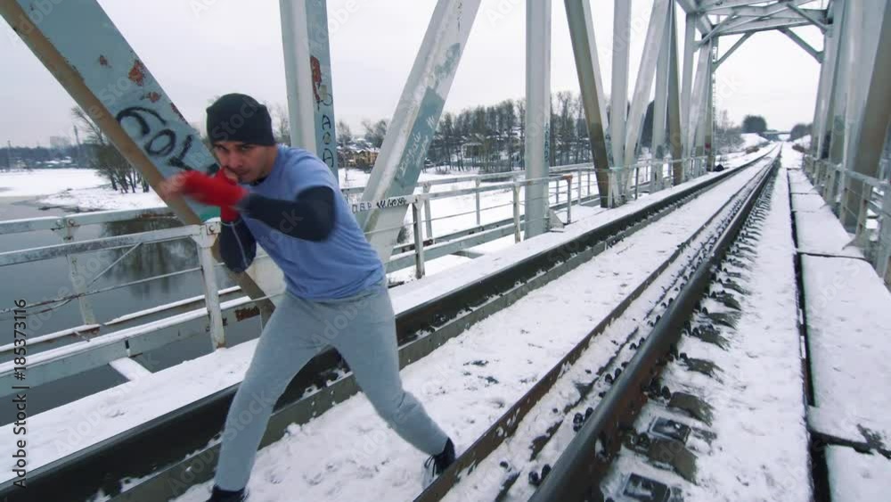 Training boxer on the bridge in winter Training boxer on the bridge in winter