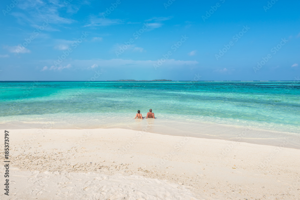 Couple relaxing on paradise beach