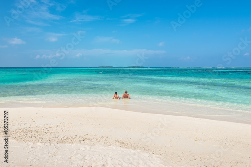 Couple relaxing on paradise beach