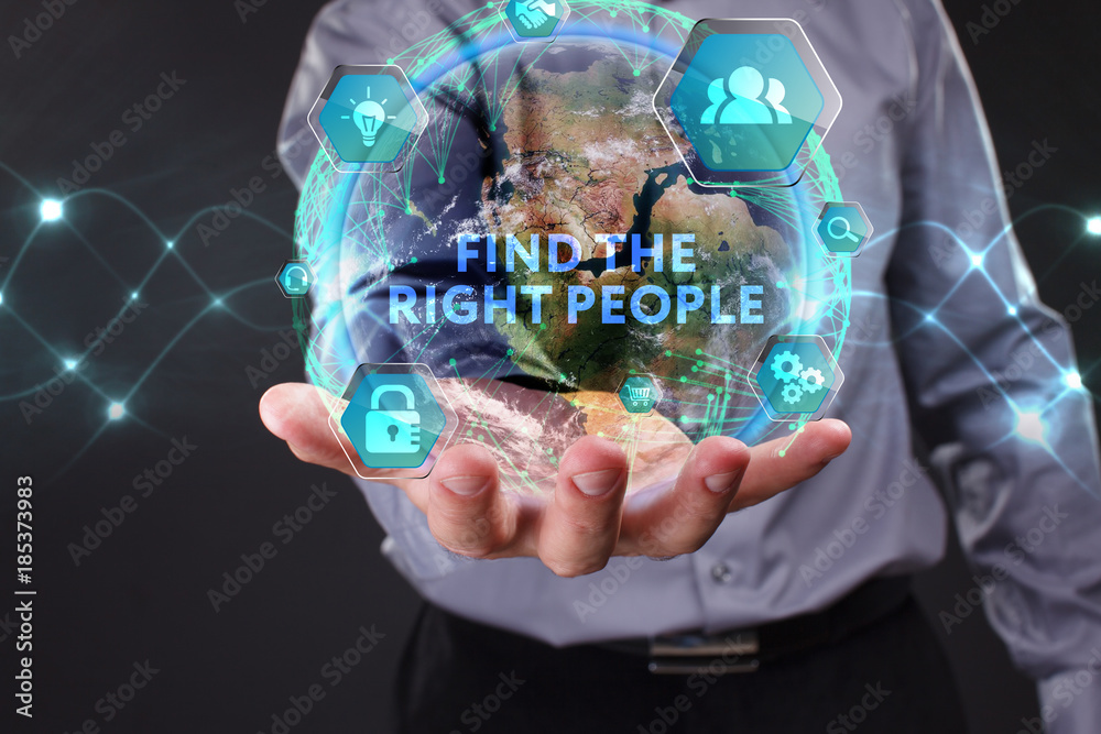 The concept of business, technology, the Internet and the network. A young entrepreneur working on a virtual screen of the future and sees the inscription: Find the right people The concept of business, technology, the Internet and the network. A young entrepreneur working on a virtual screen of the future and sees the inscription: Find the right people