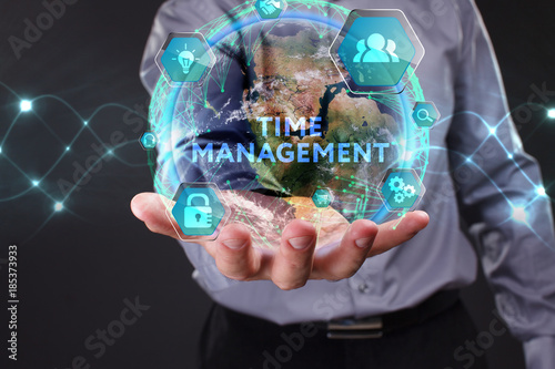 The concept of business  technology  the Internet and the network. A young entrepreneur working on a virtual screen of the future and sees the inscription  Time management