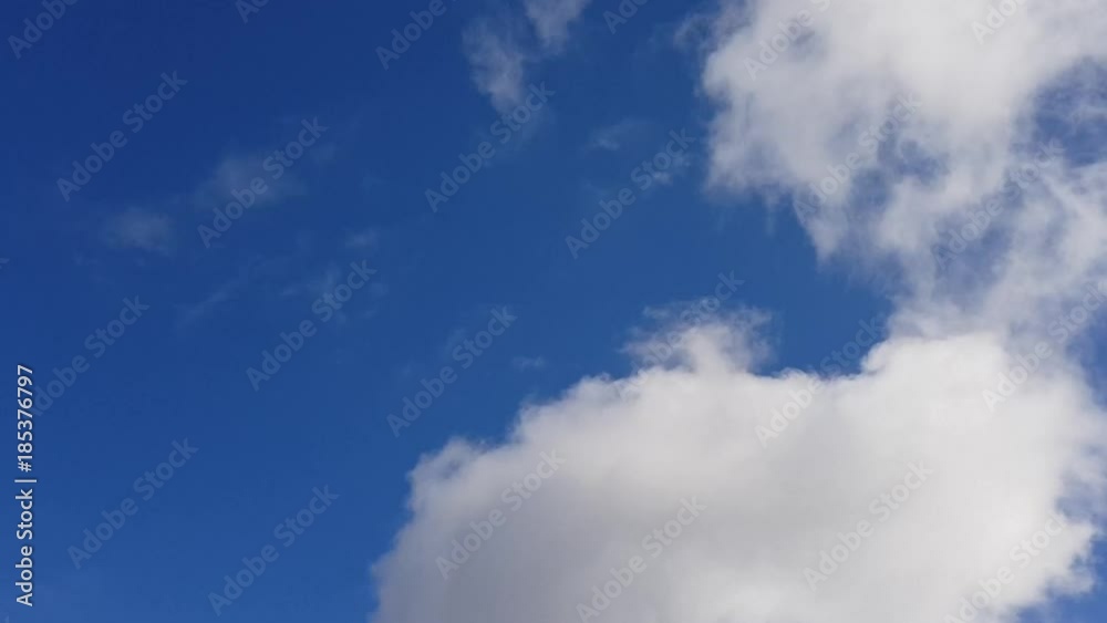 White cumulus clouds float on the blue sky. Time lapse. White cumulus clouds float on the blue sky. Time lapse.