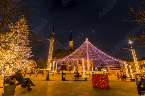 night scenery city square with Christmas tree. Cluj Napoca