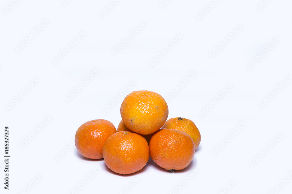 Citrus fruits (tangerines) isolated on white background with shadows Citrus fruits (tangerines) isolated on white background with shadows