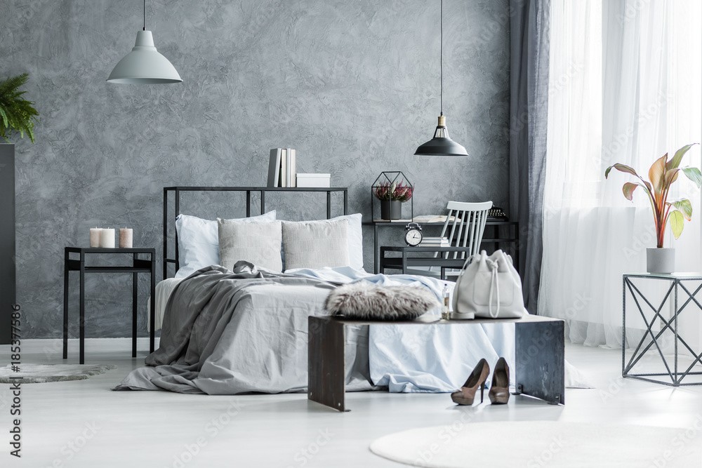 Fototapeta premium Woman's grey bedroom interior