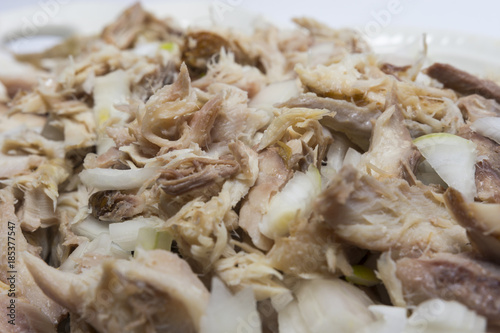 Smoked fish with onion and olive oil. Delicious dish. Fabulous taste. Selective focus.