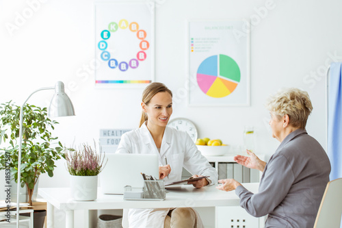 Smiling dietitian expert and patient