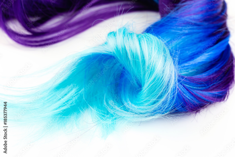 Curly voluminous shiny purple color hair on a white background Curly voluminous shiny purple color hair on a white background