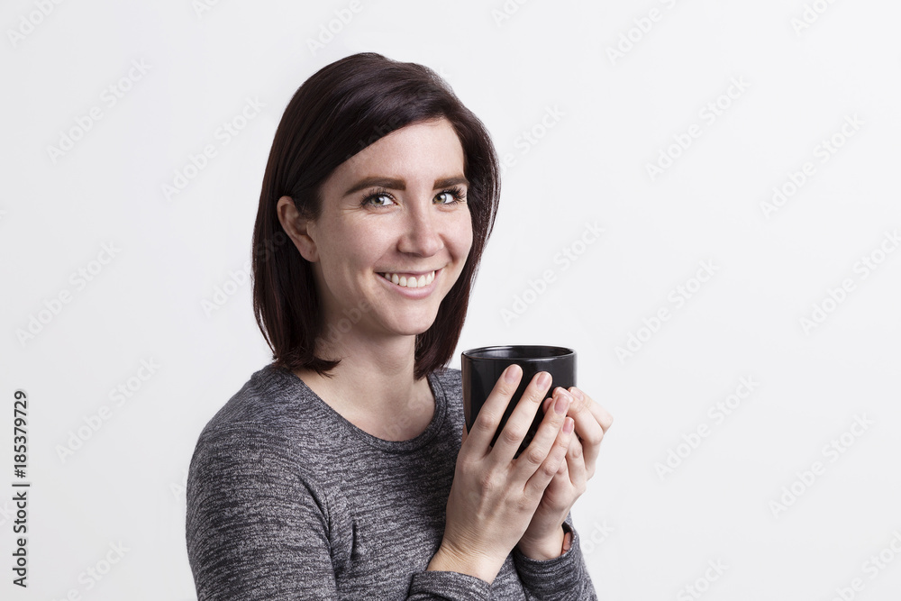 Female student enjoying a warm beverage Female student enjoying a warm beverage