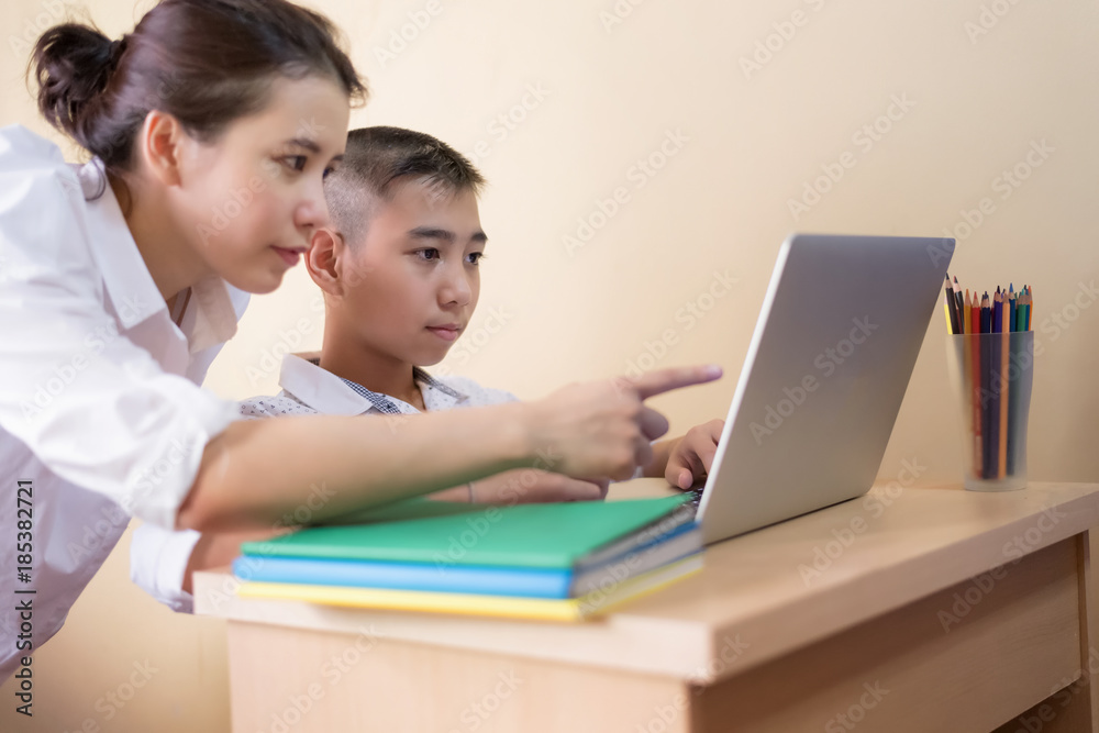 Young boy student, studying computer and is happy to learn new things new Young boy student, studying computer and is happy to learn new things new