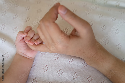 Hand the sleeping baby in the holding and repose one's trust in mother.