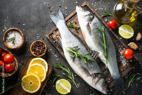 Photography Fresh fish seabass on black.